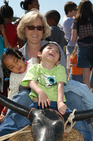 Mom holding two children with disabilities